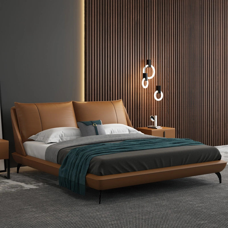 Ardelle Bed in a modern bedroom setting with a padded headboard and caramel vegan leather finish.