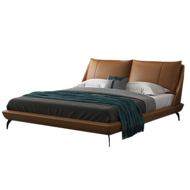 Ardelle Bed featuring smooth caramel vegan leather and a gently curved padded headboard in a modern bedroom setting.