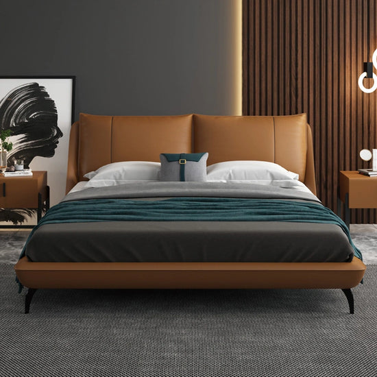 Ardelle Bed in caramel vegan leather with curved headboard and modern decor accents.