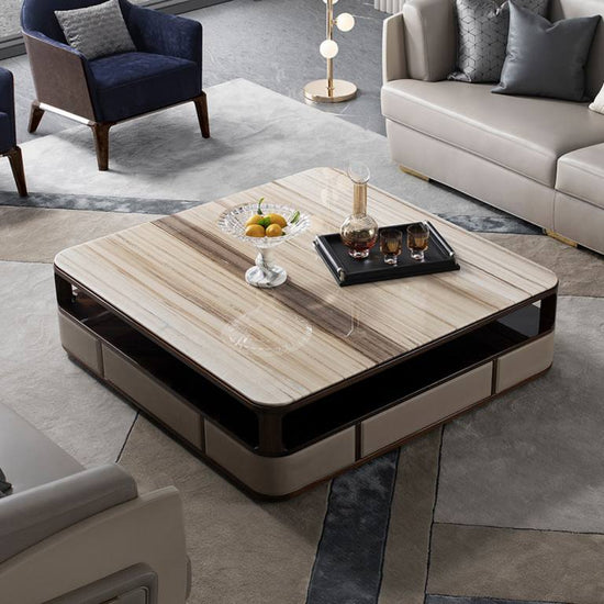 Calvino Coffee Table featuring a natural marble top and modern design in a stylish living room setting.